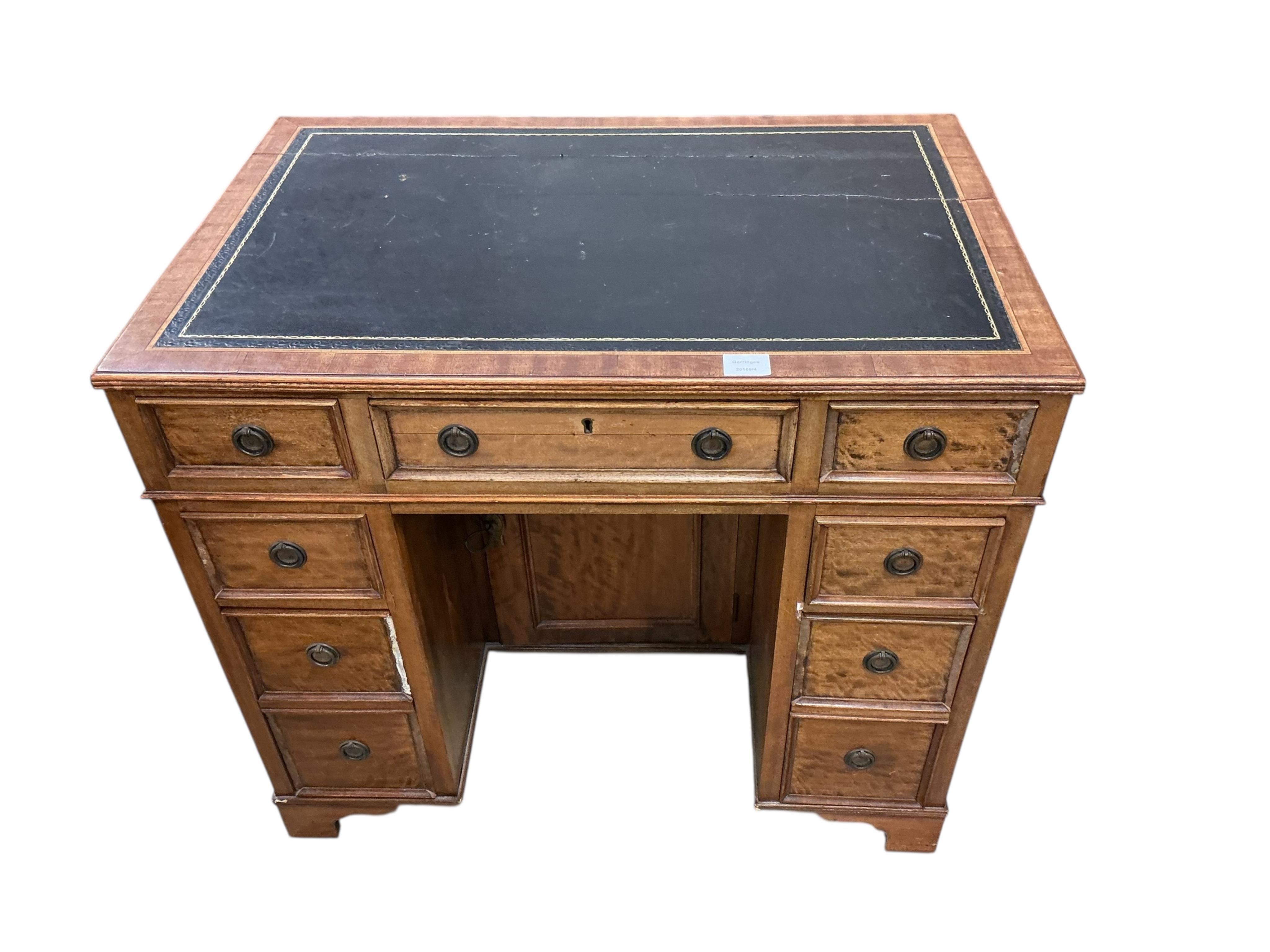 A reproduction mahogany kneehole desk, width 86cm, depth 57cm, height 75cm